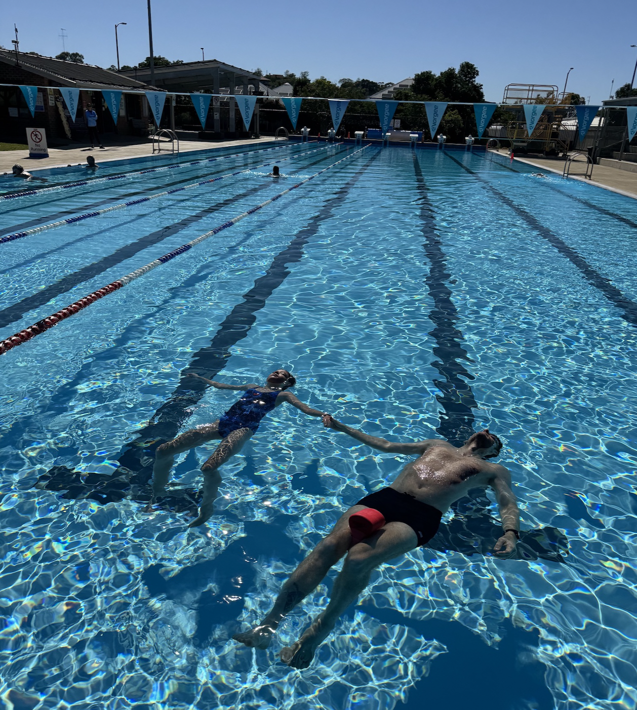 Practicing swimming at the outdoor pool